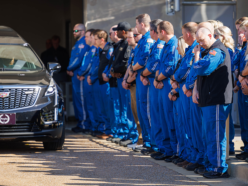 UMMC leaders and AirCare and Mississippi Center for Emergency Services team members pay their respects during a procession Tuesday.